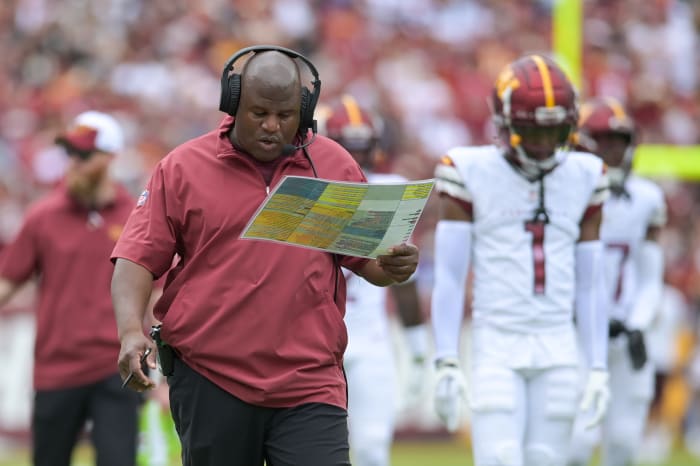 Washington Commanders assistant head coach/offensive coordinator Eric Bieniemy walks down the sidelines during the first half against the Arizona Cardinals at FedExField.